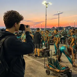 Pre-Parade Dawn. Capture the early-morning parade staging energy.