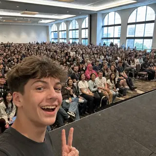Panel Front Row. Capture a shot from inside a packed panel with the crowd behind you.
